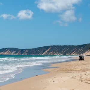 Drive along Rainbow Beach to Double Island Point passing the Coloured Sands